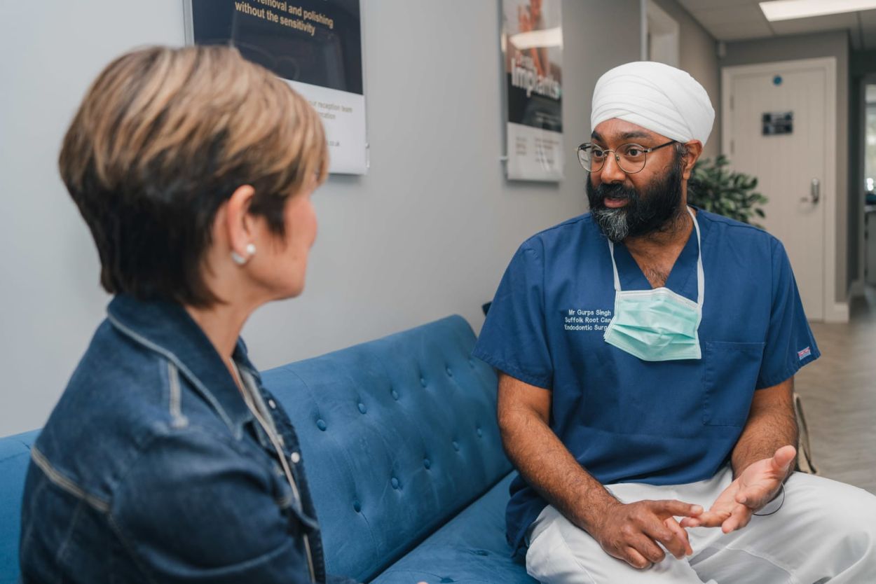 Dentist talking with a patient at Hadleigh Dental Surgery
